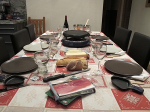 Raclette maker is the round black thing.